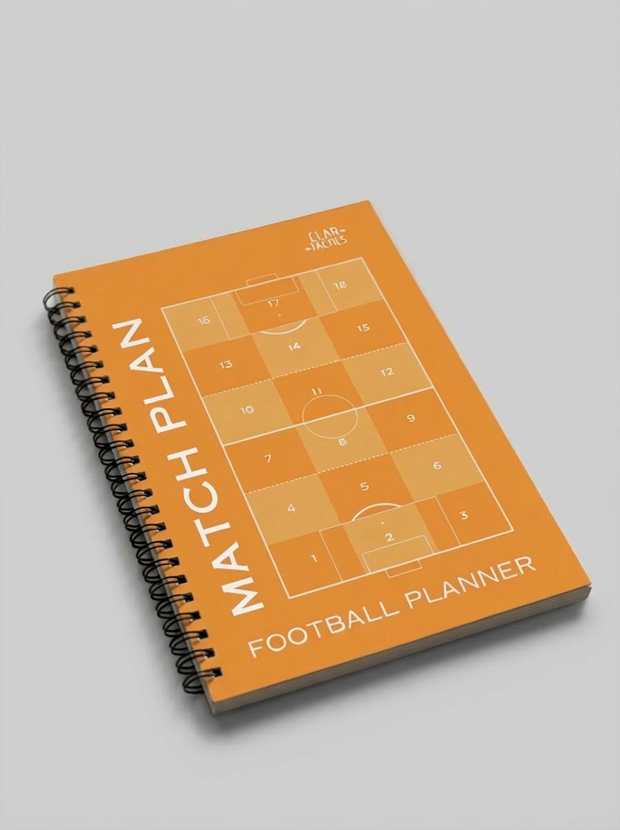 Football planner with match plan design on an orange cover and soccer field