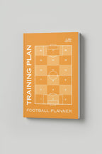 Football planner with training plan design on an orange cover against a gray background