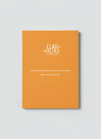 Orange planner with 'Clartactics' branding on a light gray background